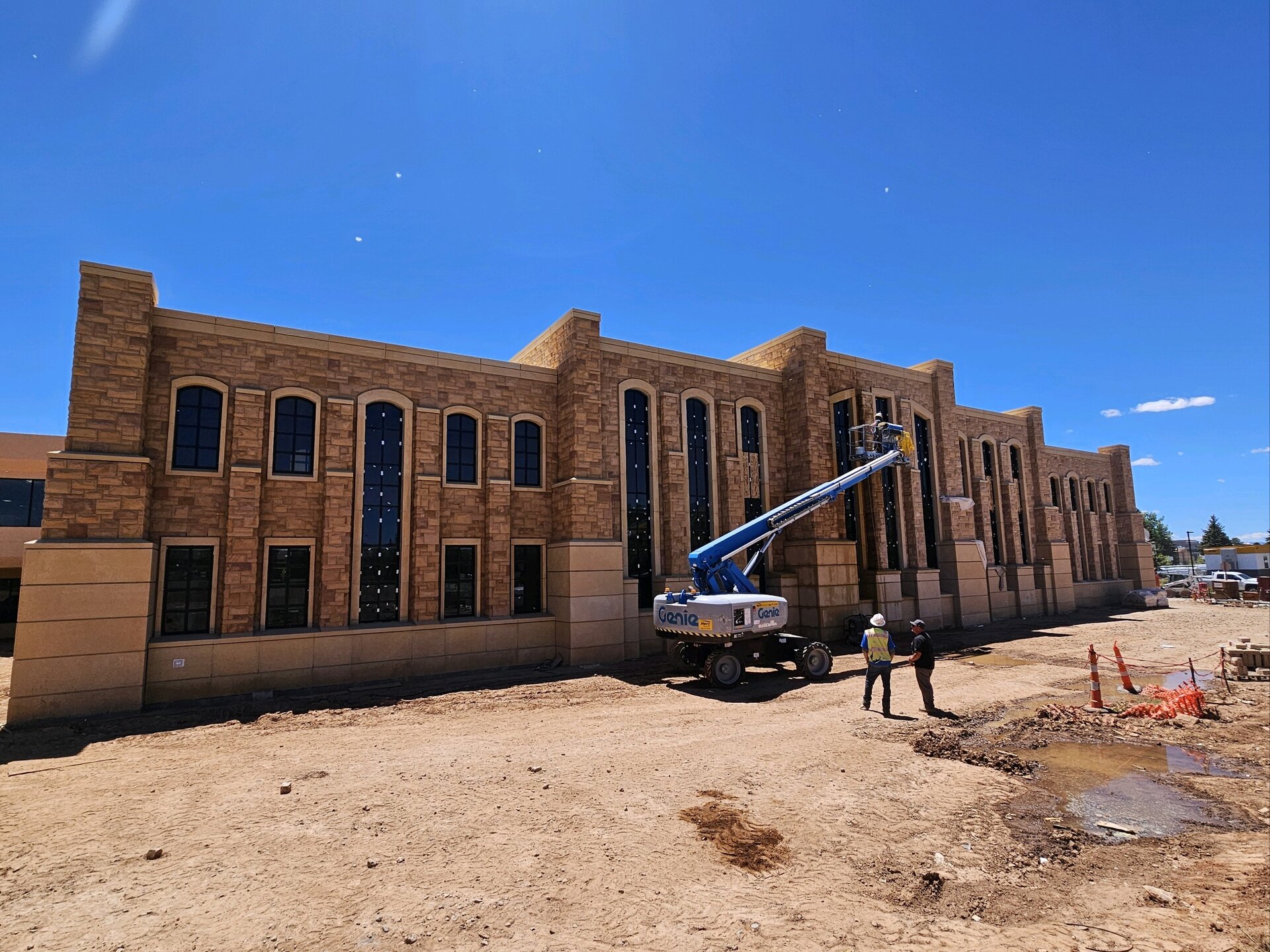 Arched sandstone facade under construction